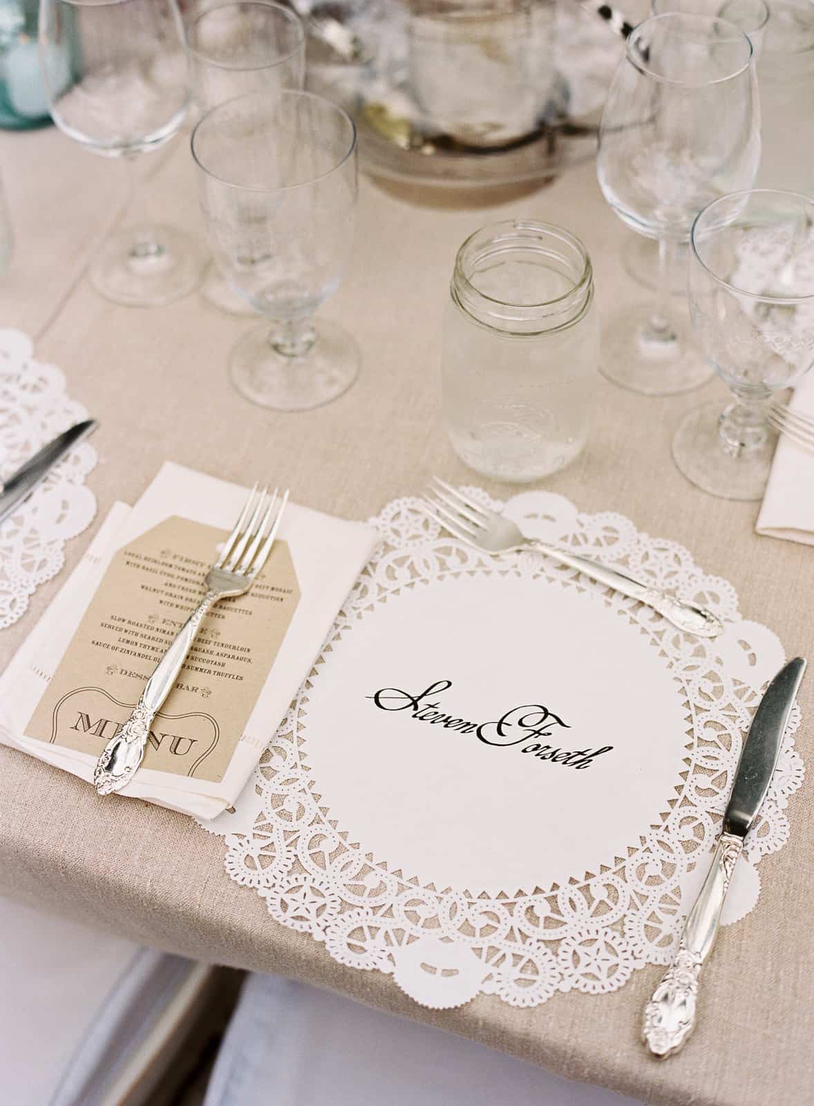Dinner place setting with hand lettered doilies