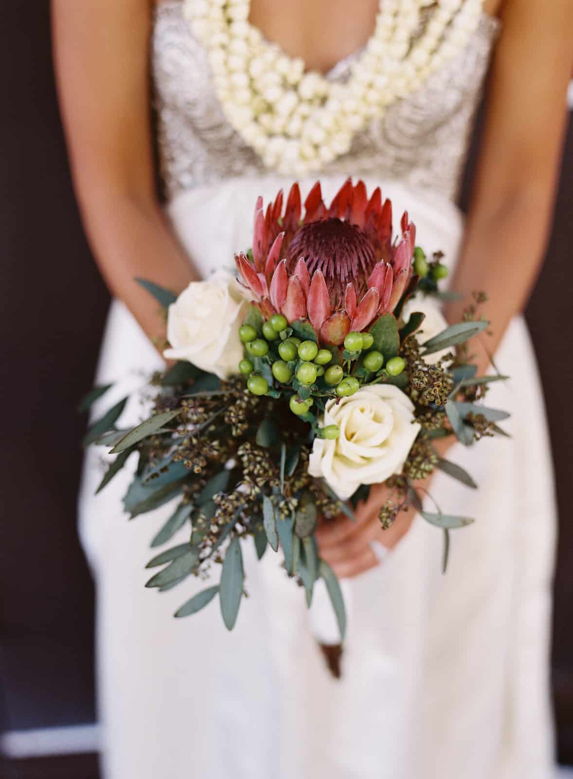 Protea and white rose bouquet