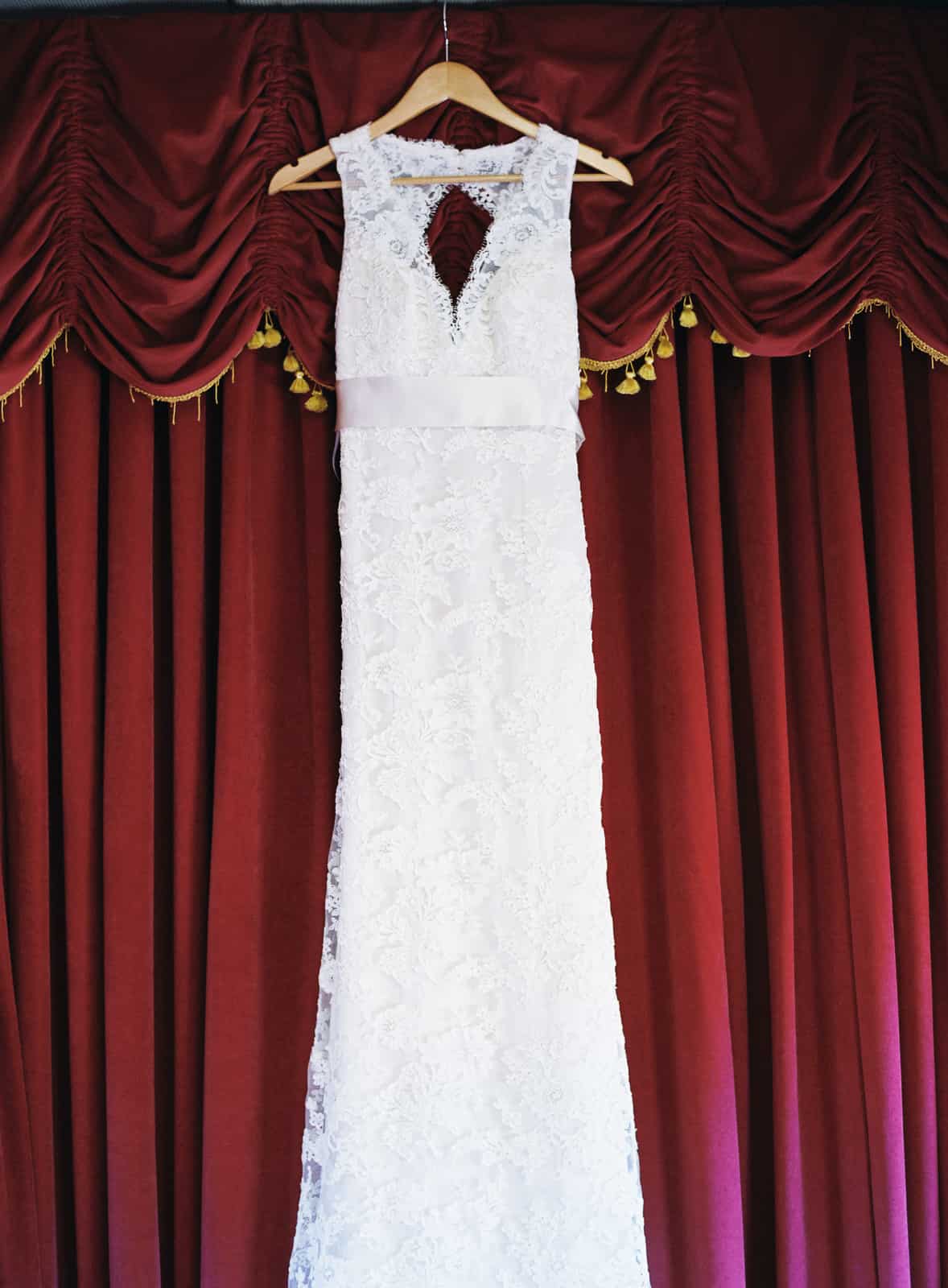 Monique Lhuillier wedding dress on a hanger