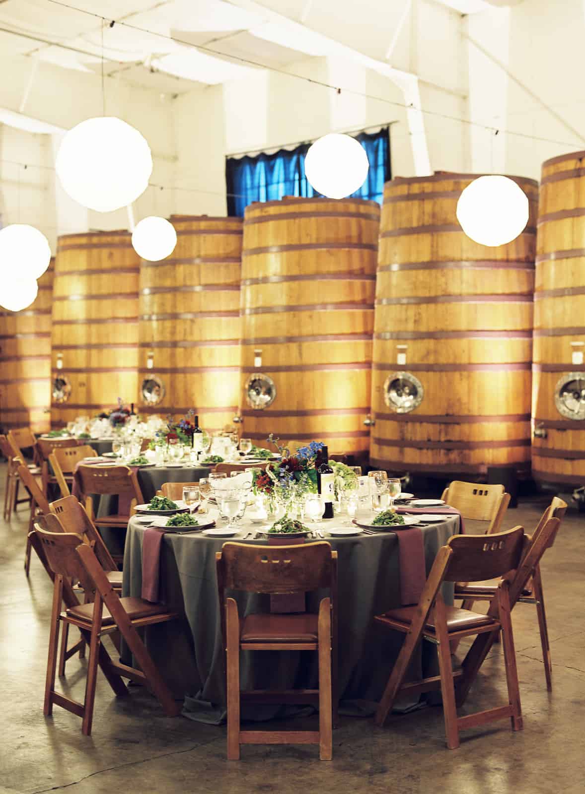 Table setttings in front of wine vats