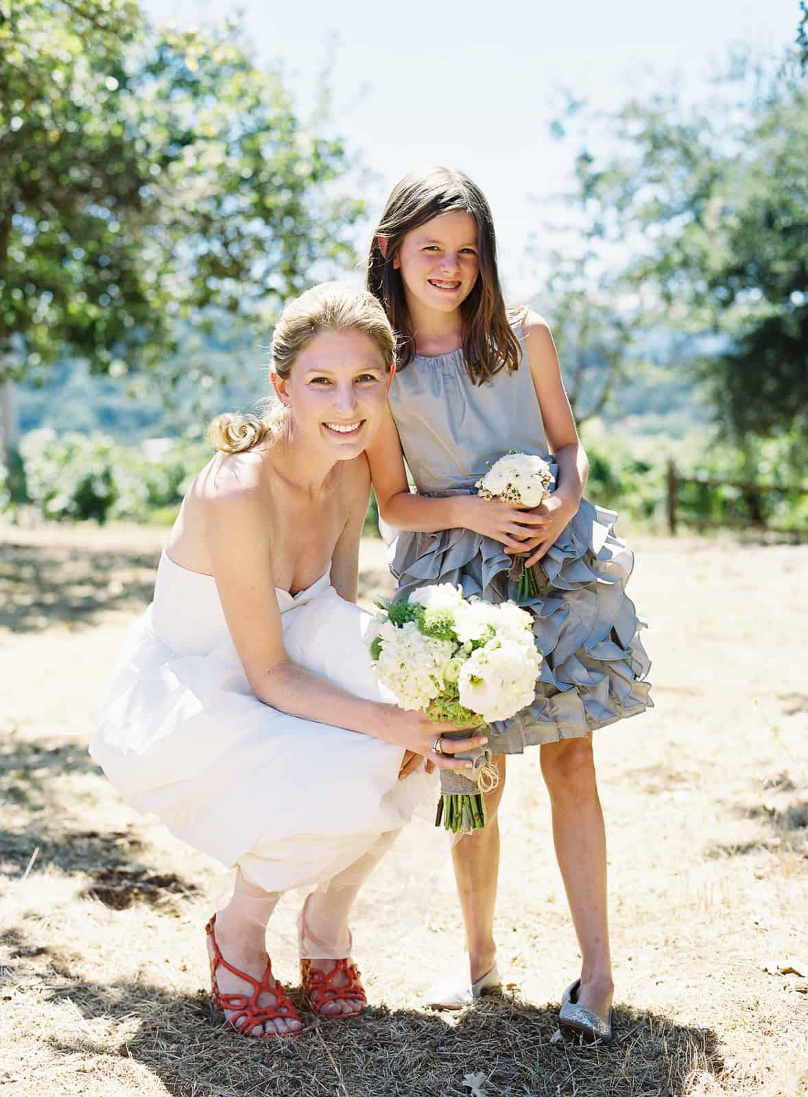 bride and flower girl in gray ruffled dress