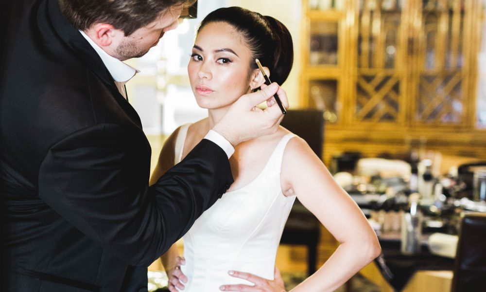 bride getting makeup done