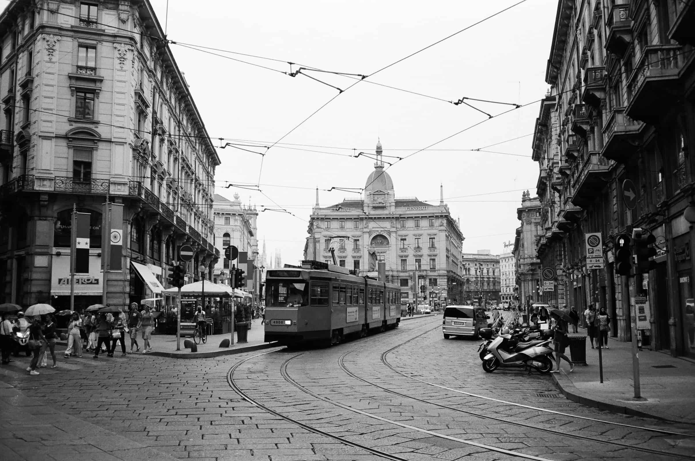Tram and people walking in central Milan
