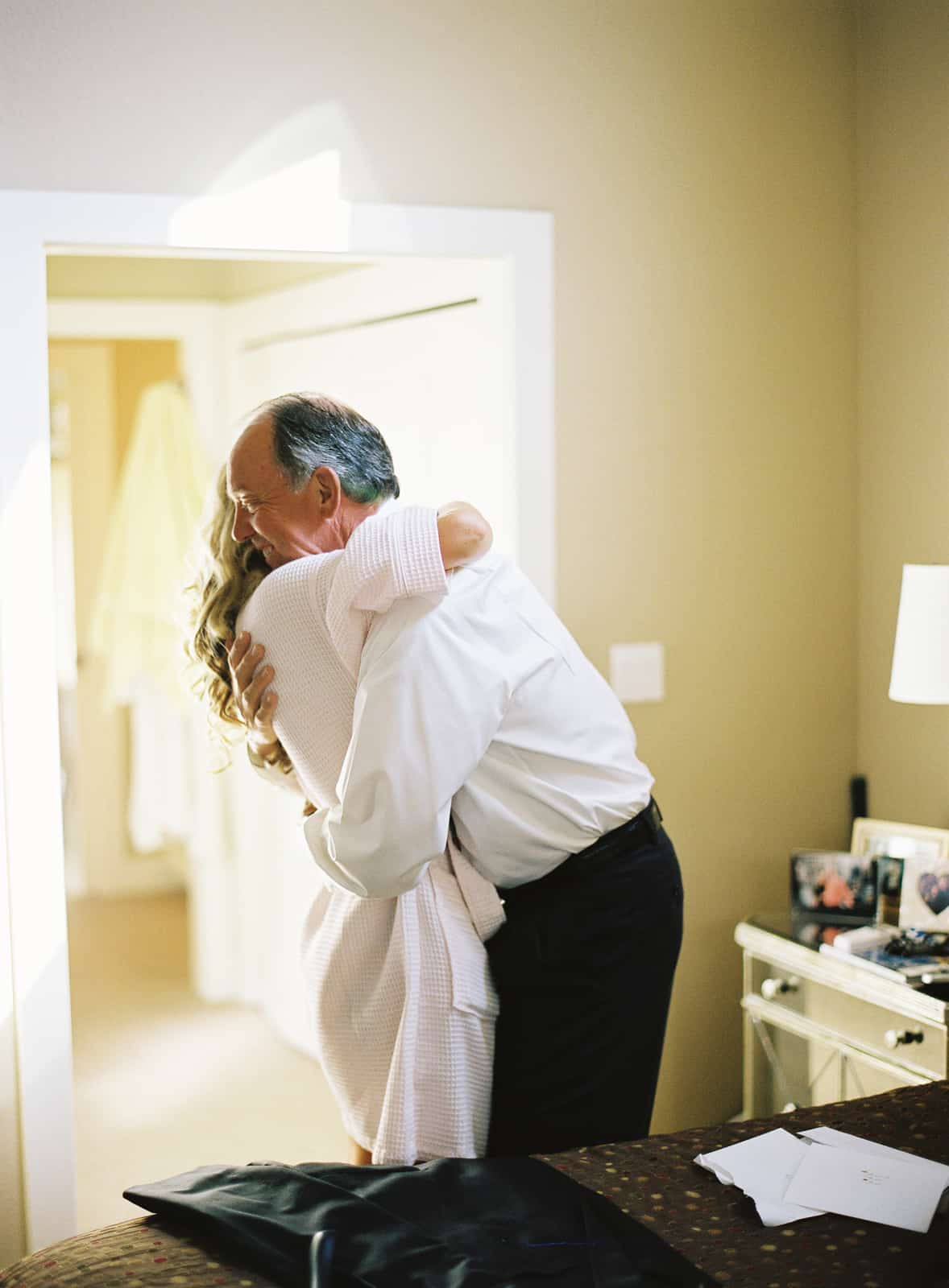 Father hugging bride