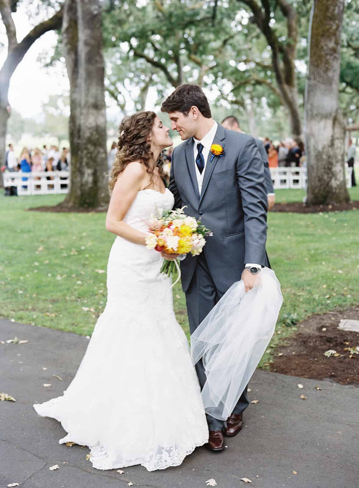 yellow bouquet boutonniere gray suit
