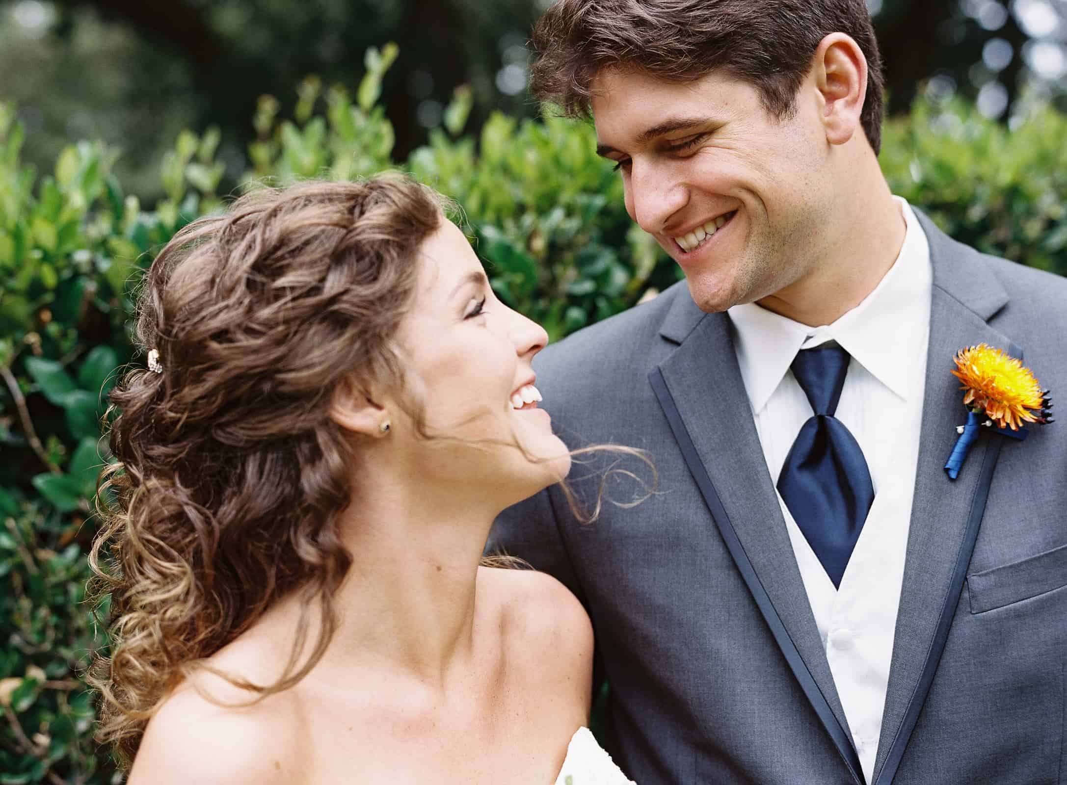 smiling gray blue groom suit