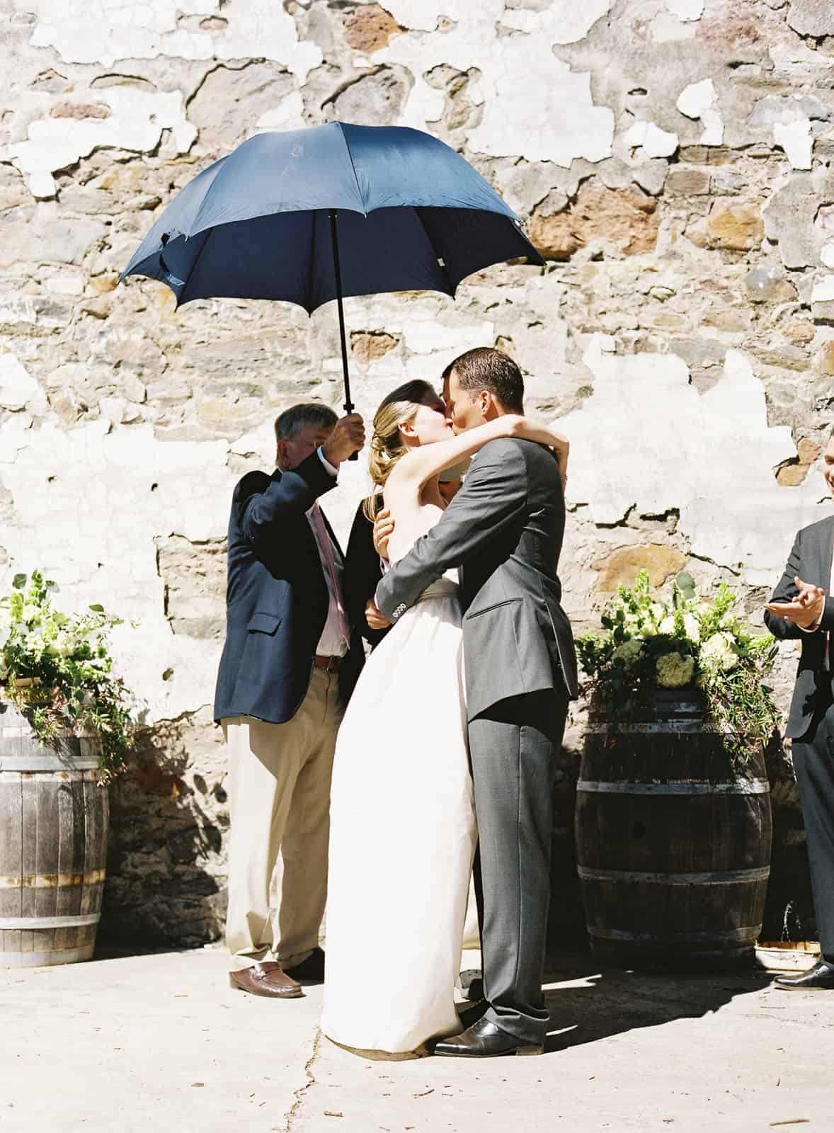 first kiss under umbrella
