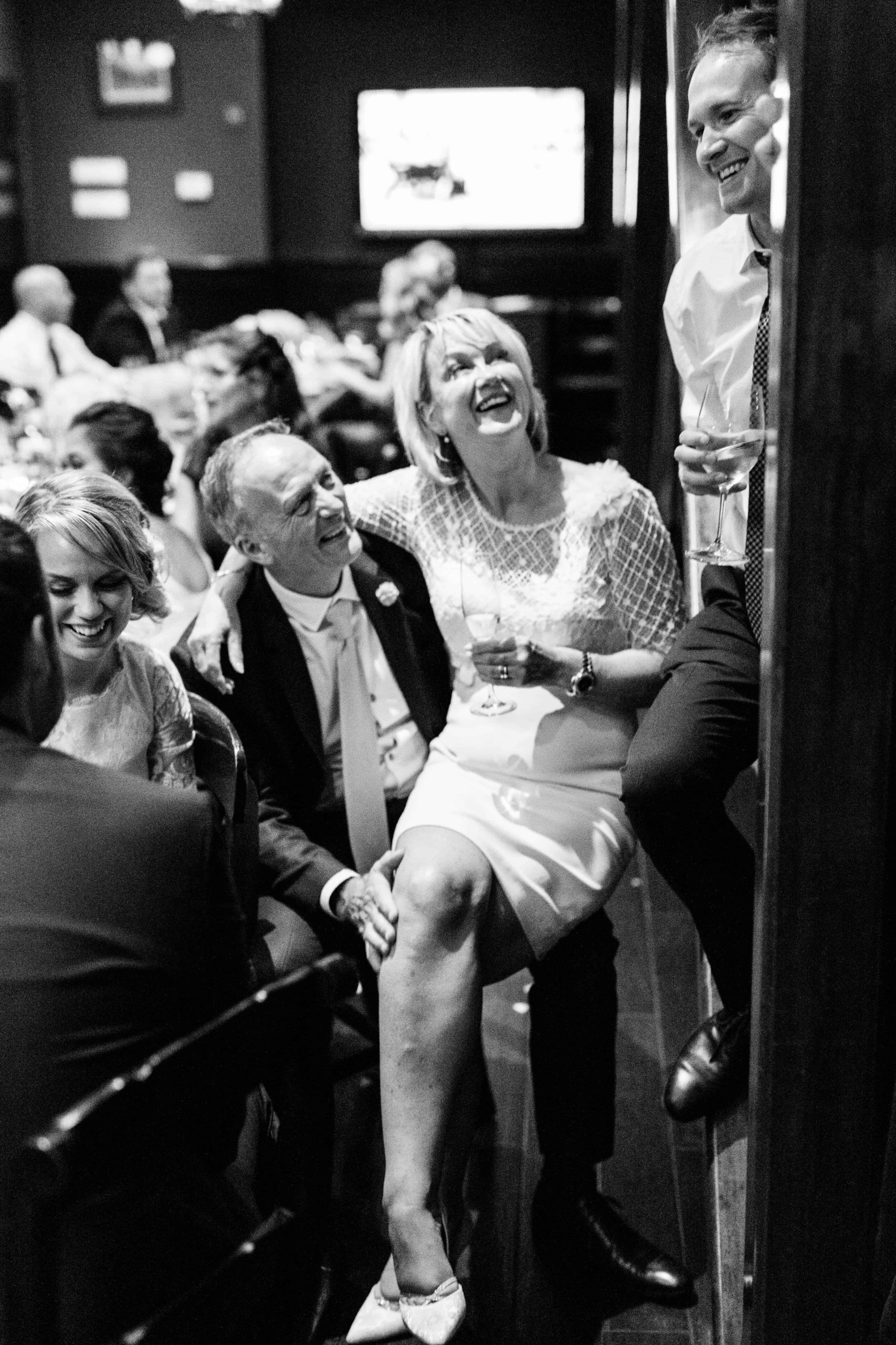 groom's parents laughing