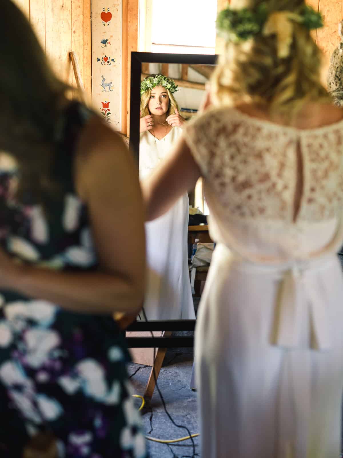 bride looking in mirrot