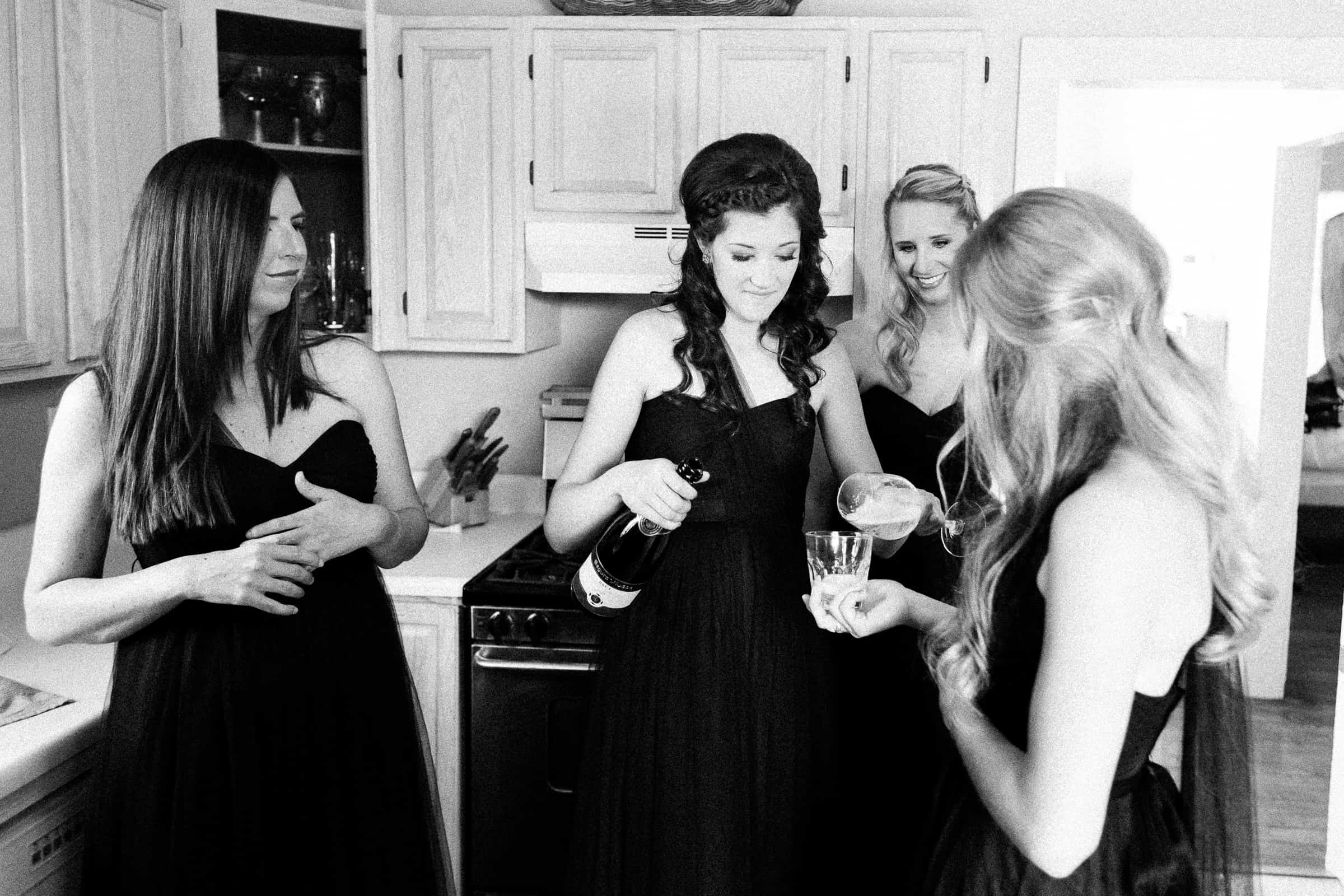 bridesmaids pouring champagne