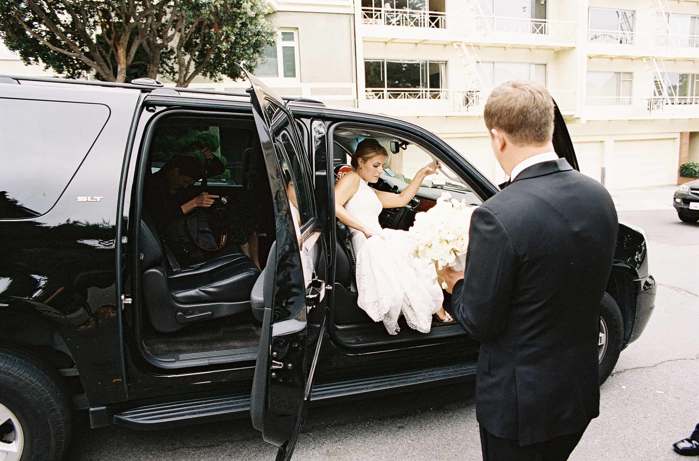 bride getting out of black suv
