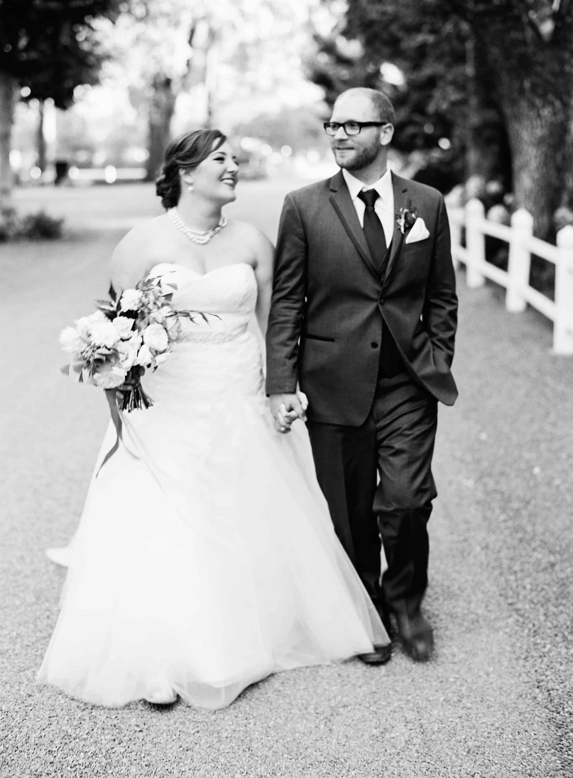 couples portrait walking in black and white