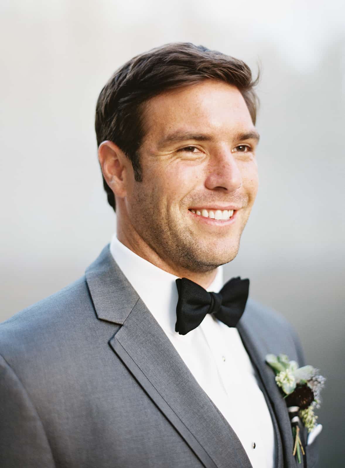 groom portrait black bow tie