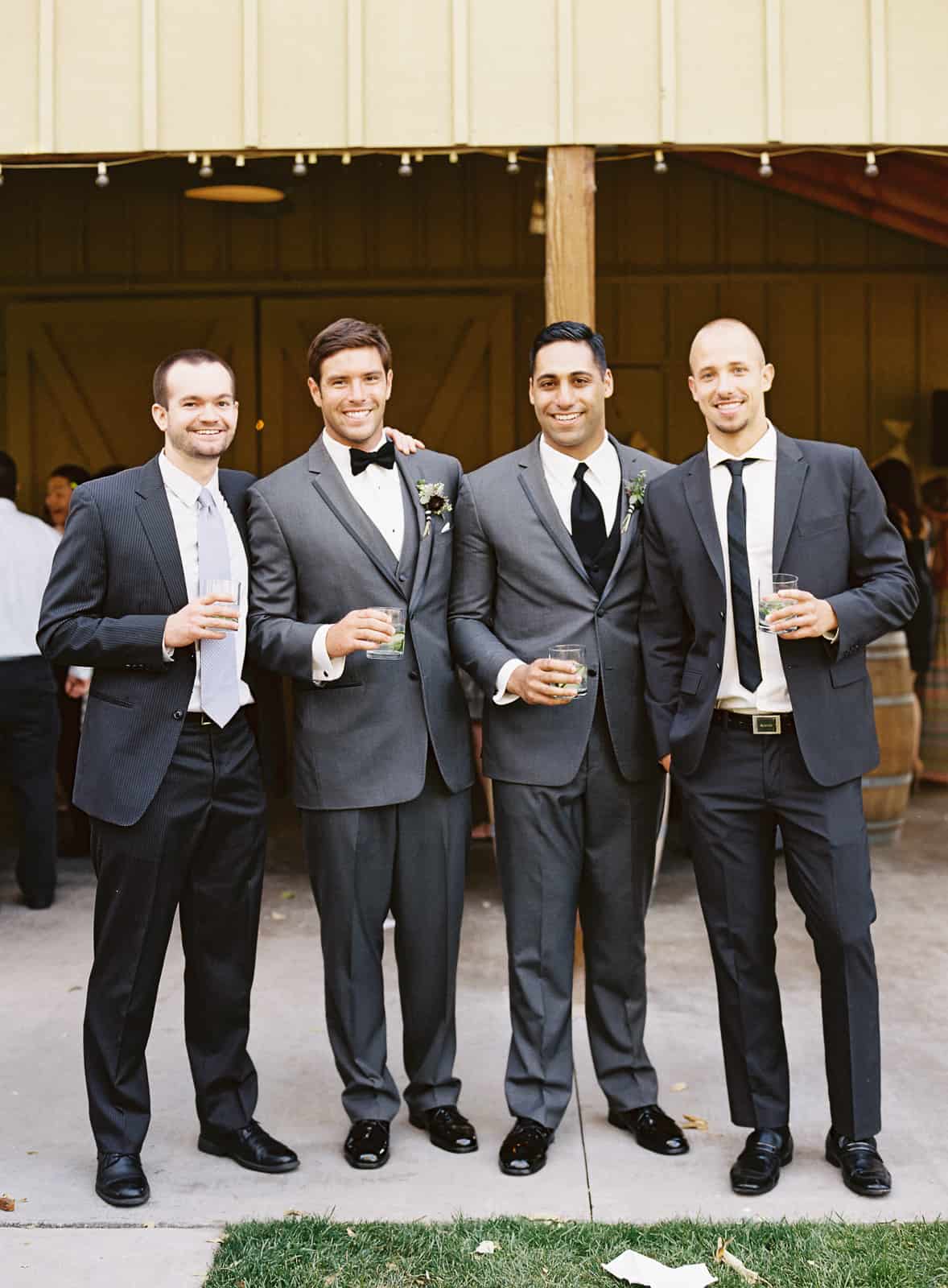 groom with guests and drinks