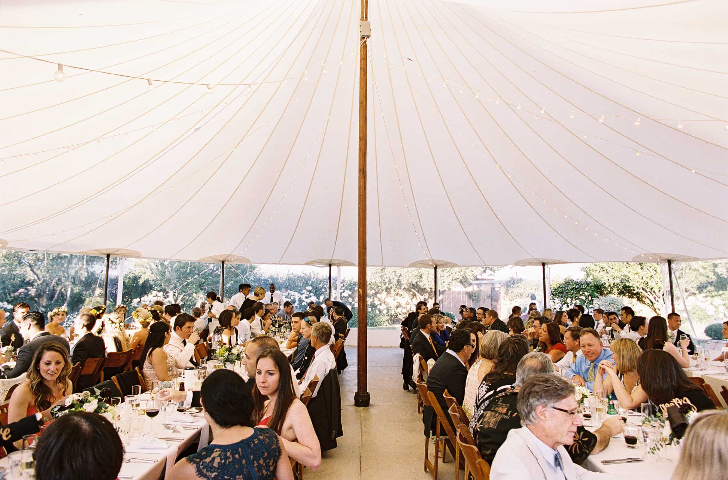 guests dining in a circus tent