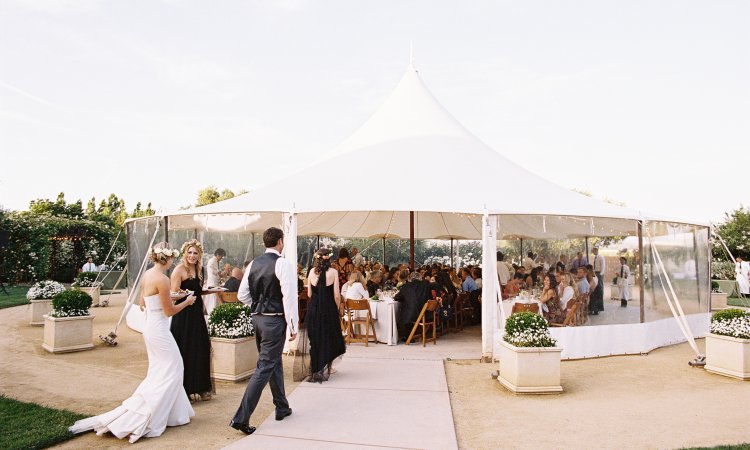 white circus tent wedding dinner