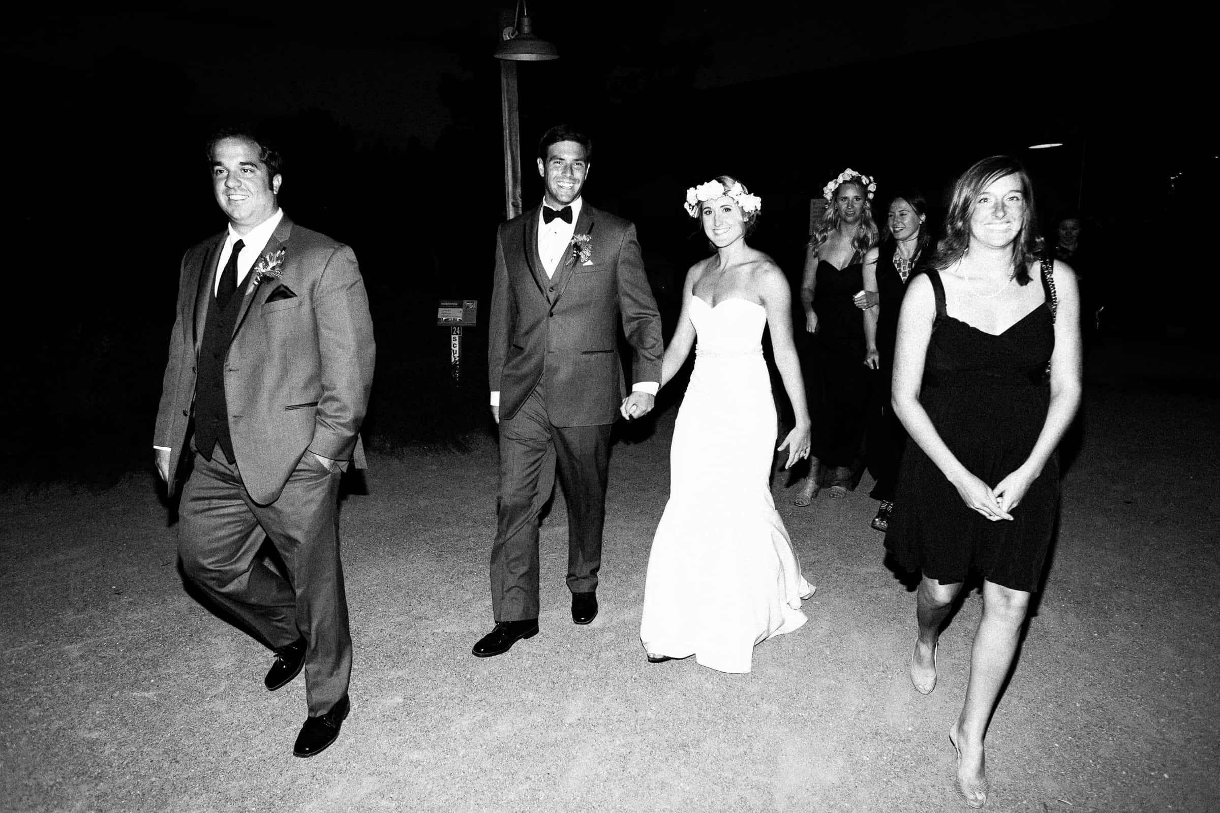 couple walking with guests
