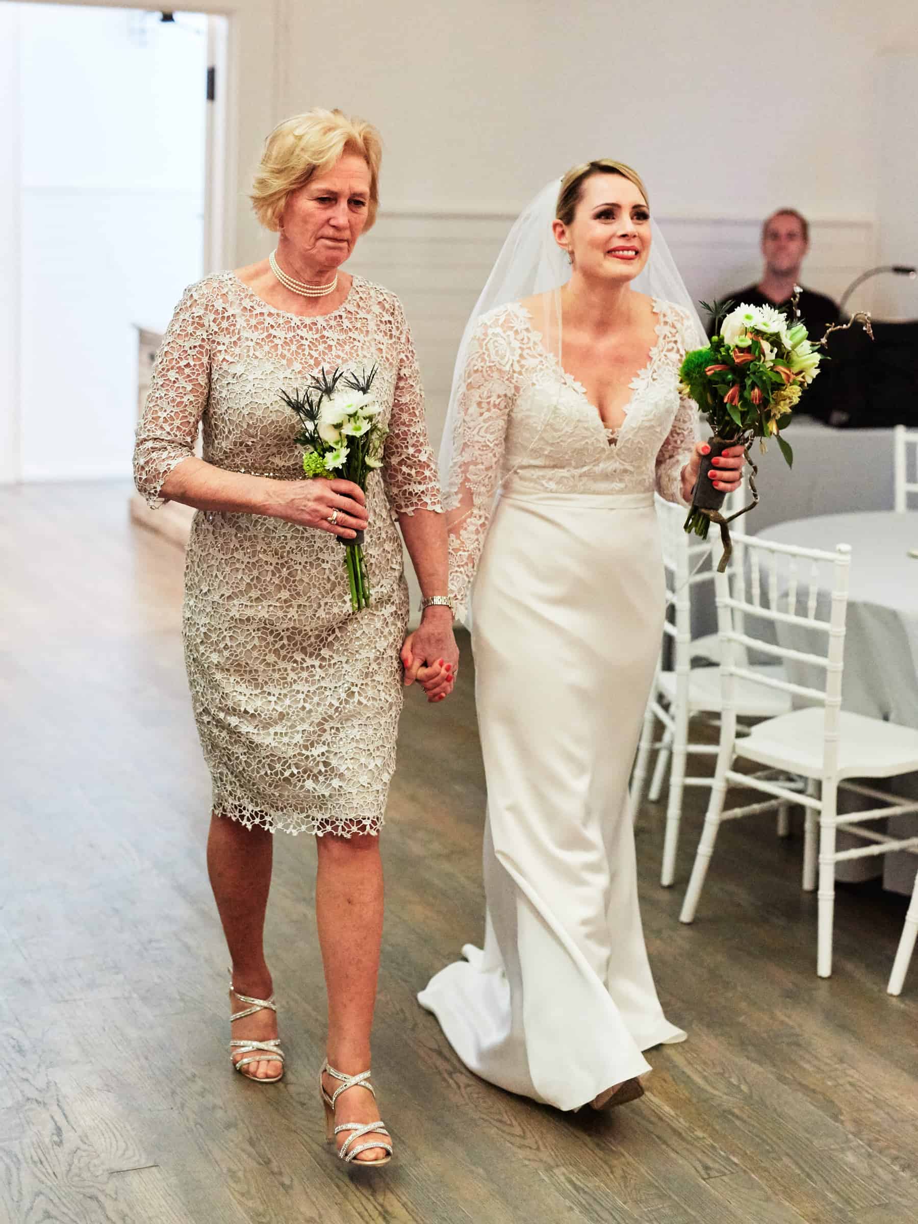 mom walking bride down aisle