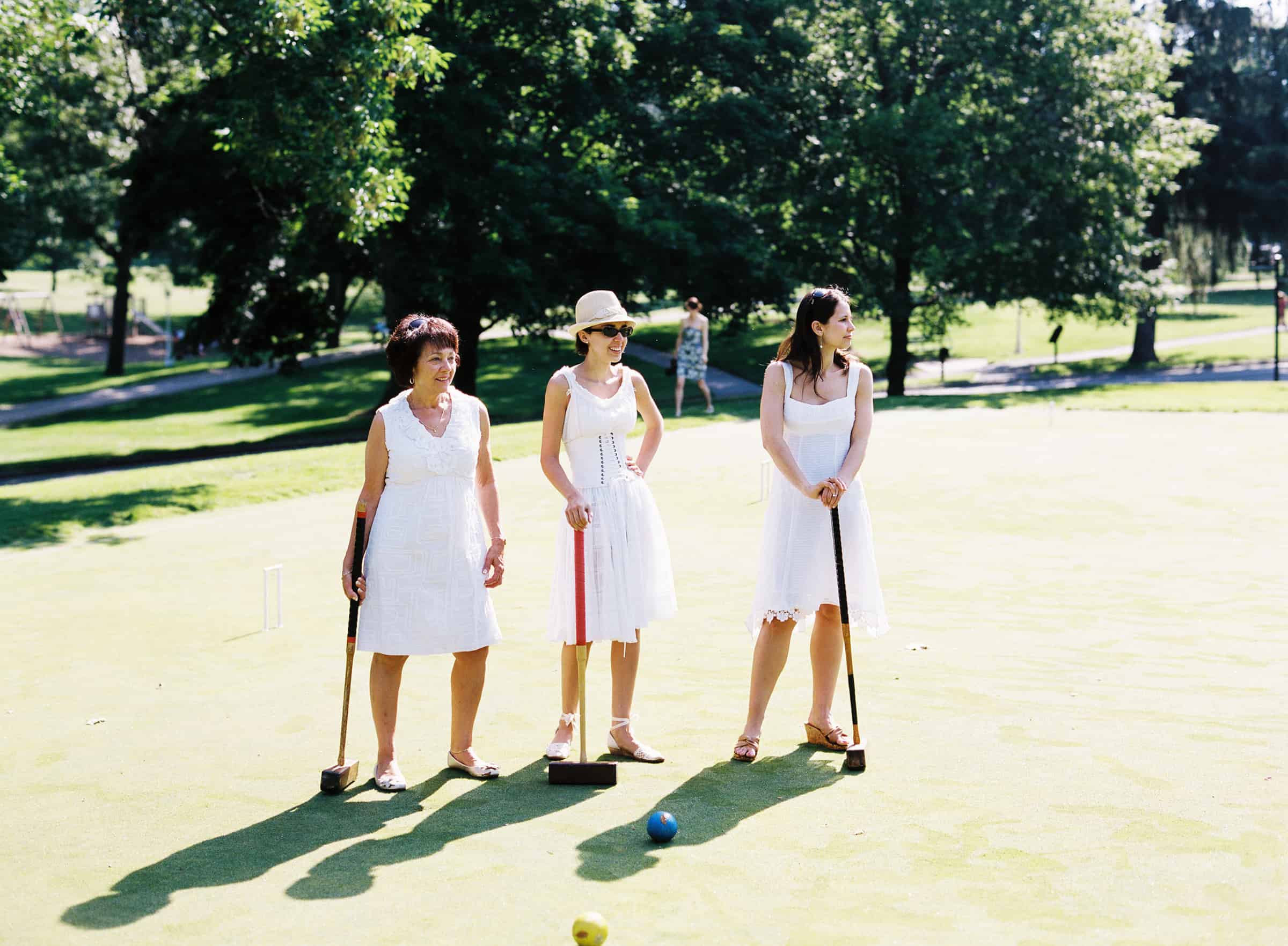 bride and guests playing croquet