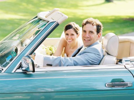 married couple in vintage mercedes-benz 560 SL