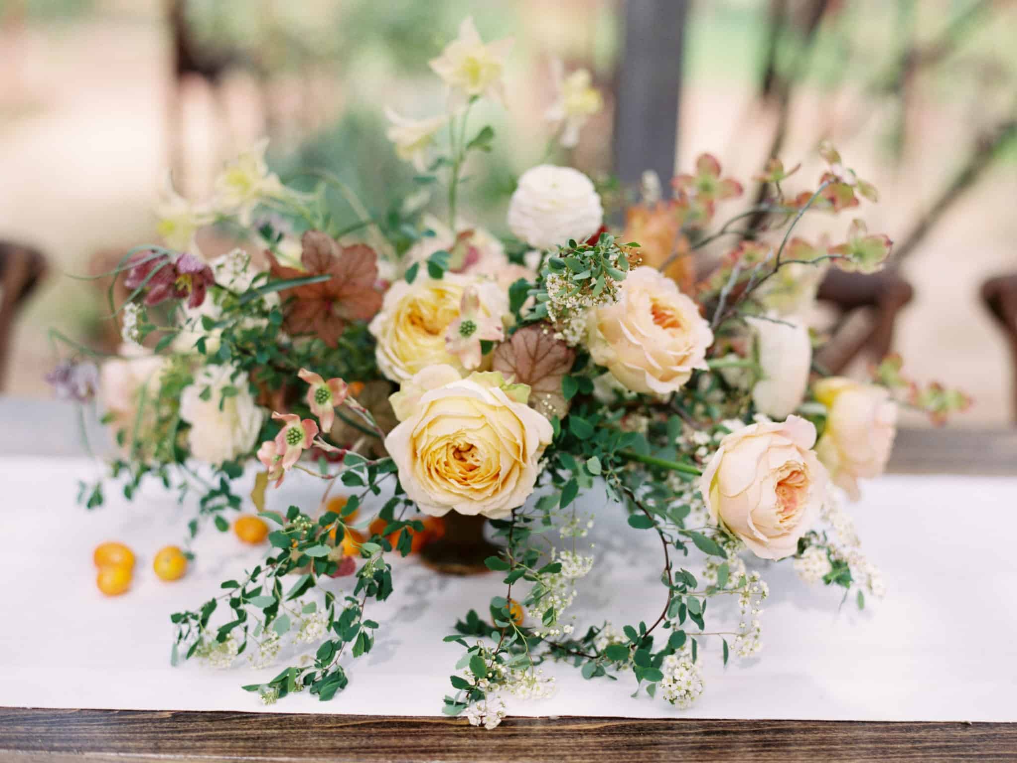 earth tone floral arrangement at wedding reception