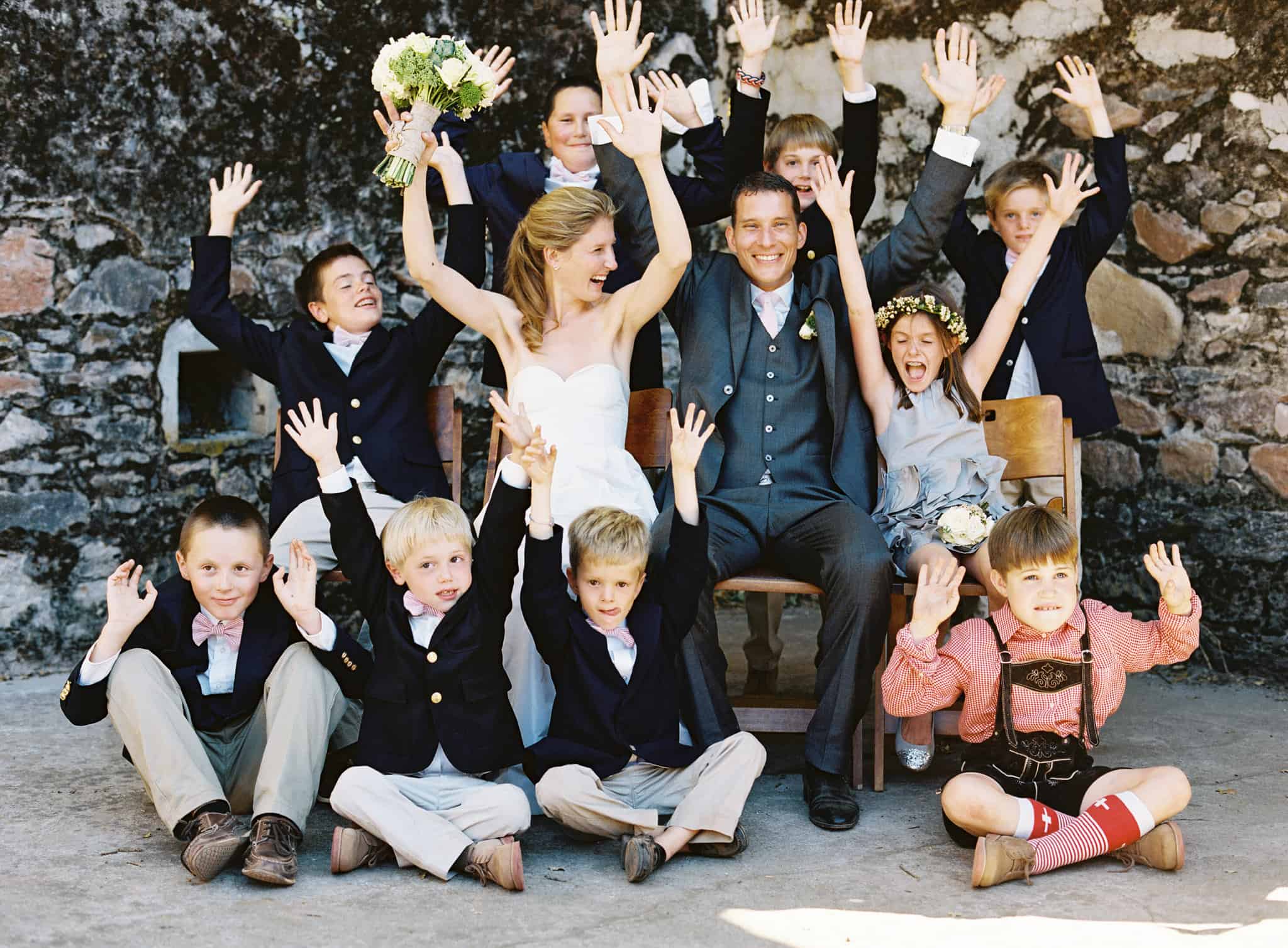 bride groom and kids haing fun at kunde family vineyard