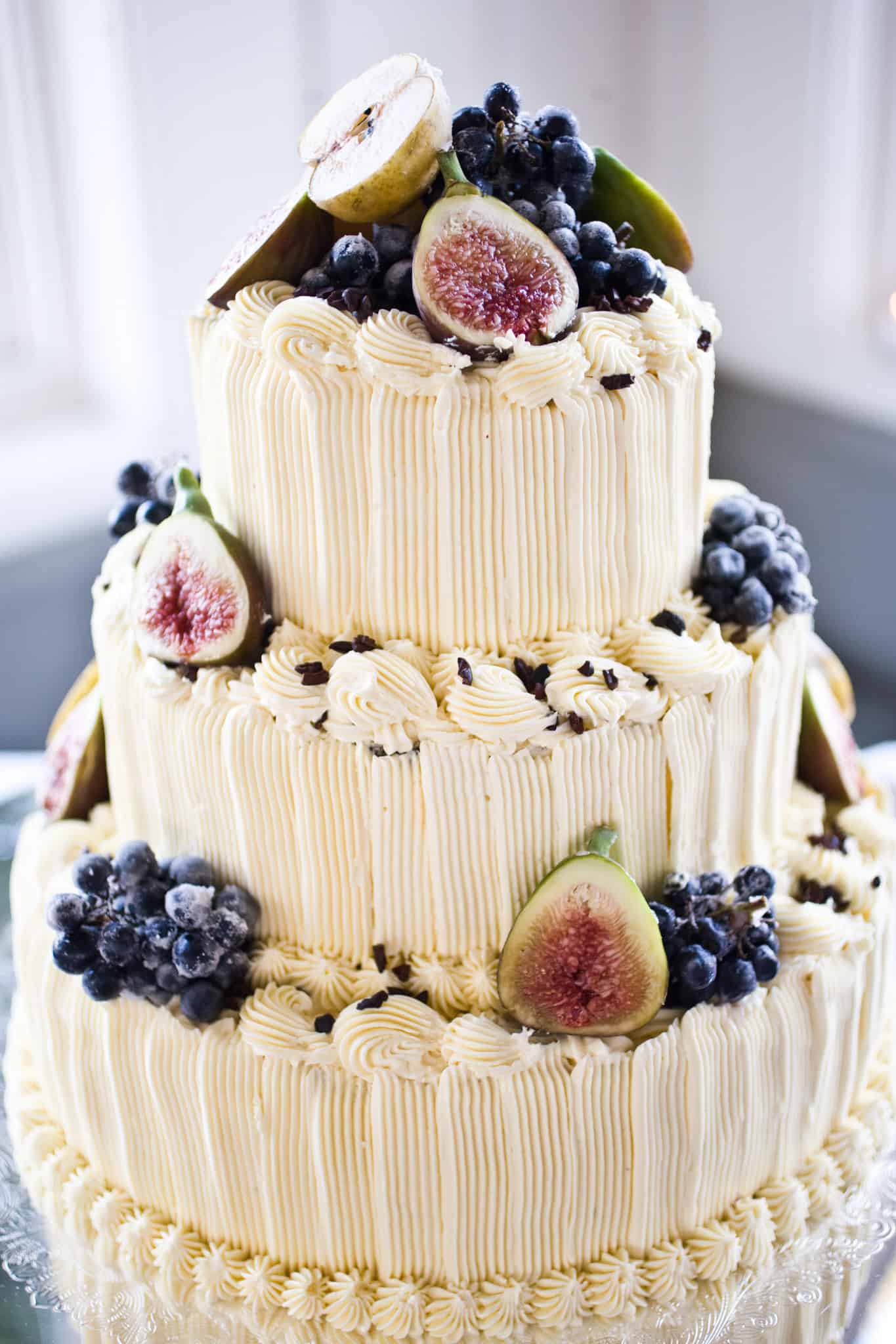 wedding cake with fresh fruit figs blueberries and pears