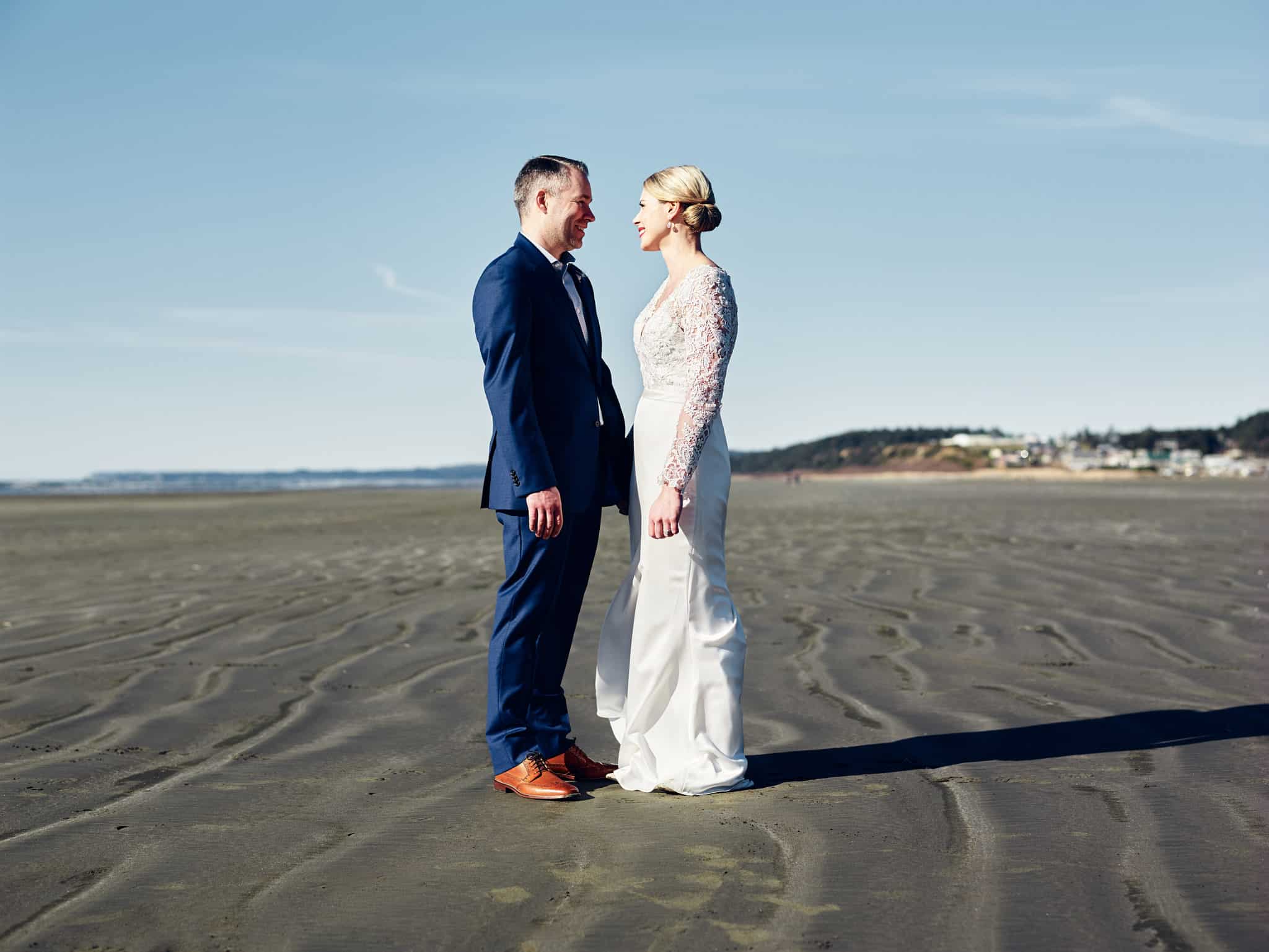 portrait of couple on beach at Seabrook Washington wedding