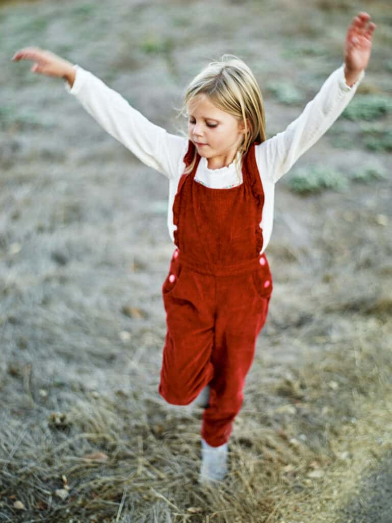 girl dancing in field
