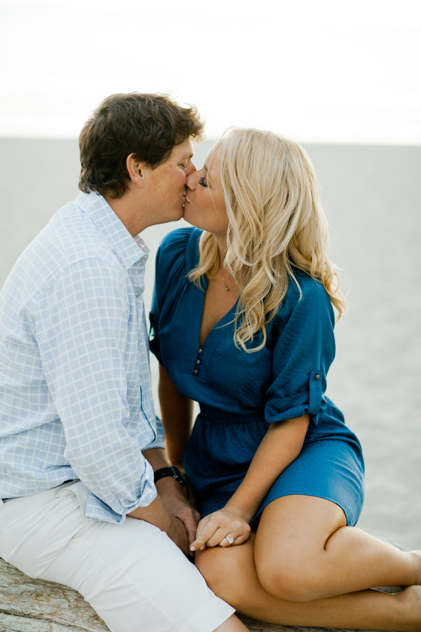couple kissing on the beach in carmel